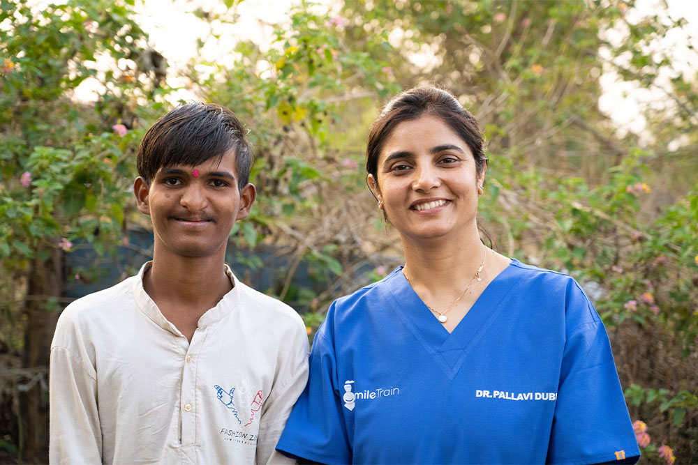 Sujal smiling with Dr. Pallavi Dube after cleft surgery