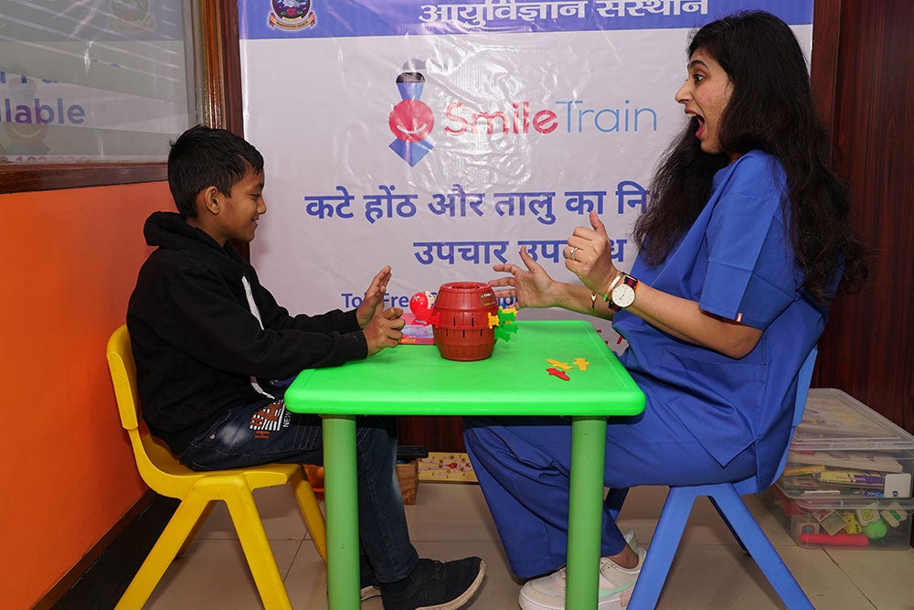Payal works with a speech patient