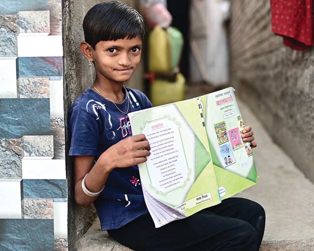 A studious child who dreams of becoming a teacher