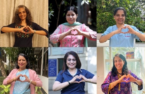 Smile Train India staff and partners smiling and holding up the International Womens' Day heart sign