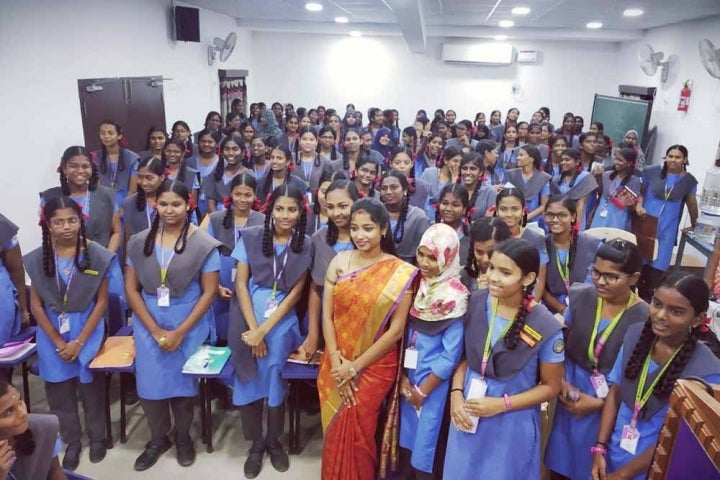 Dr Saranya Jaikumar smiling with a crowd