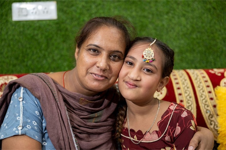 Bhumika smiling with her mother Jyoti after cleft surgery