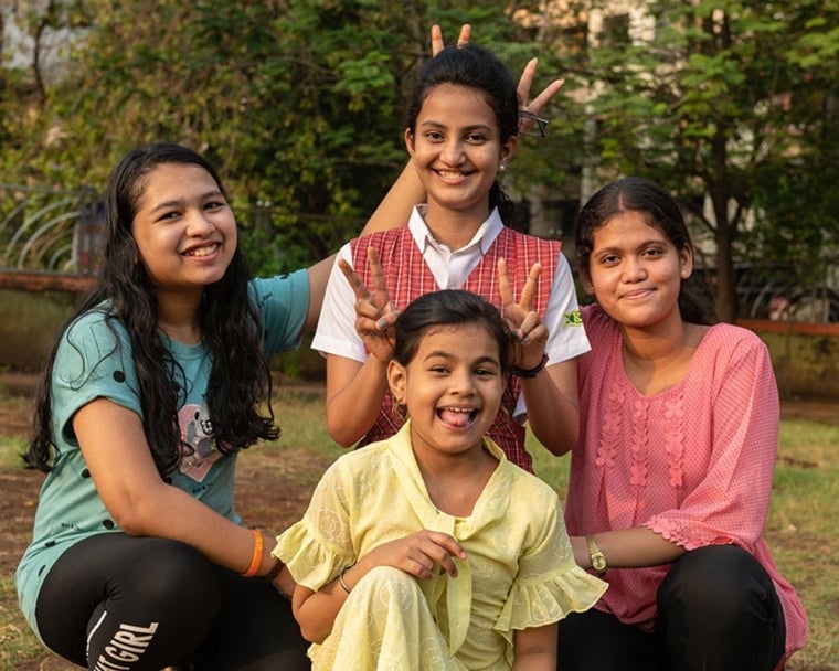 Bhargavi smiling with her family after cleft surgery