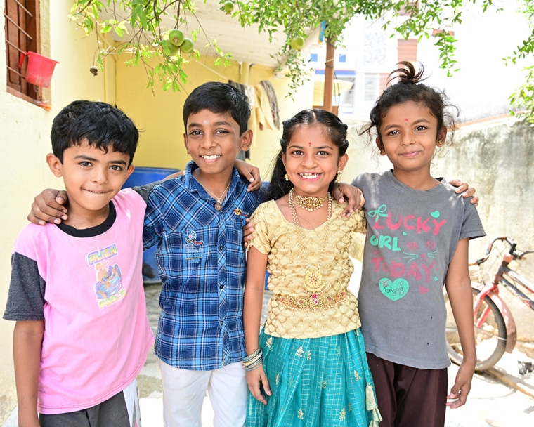 Pravallika smiling with her friends after cleft surgery